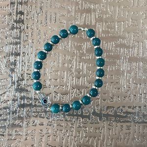 Large (mens size), evil eye hand made bracelet, stretchy doesn’t break